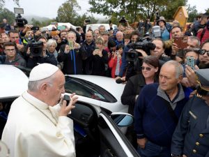 Pope Francis talks to people of Amatrice using a car loudspeaker in Amatrice, Italy, October 4, 2016. REUTERS/Osservatore Romano/Handout via Reuters ATTENTION EDITORS - THIS IMAGE WAS PROVIDED BY A THIRD PARTY. EDITORIAL USE ONLY. NO RESALES. NO ARCHIVE. - RTSQNE0