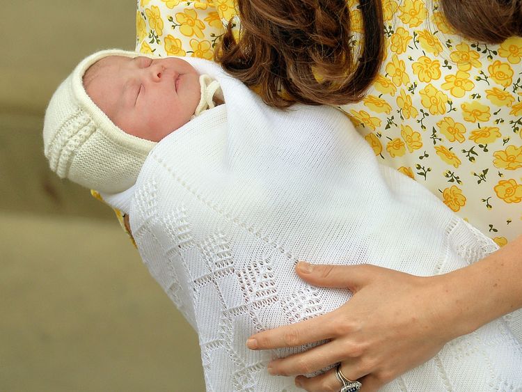 Catherine holds Princess Charlotte outside the Lindo wing