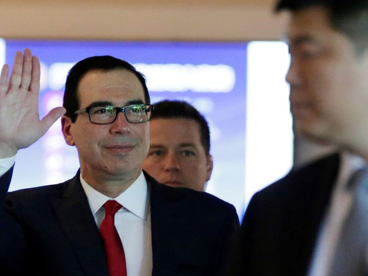 U.S. Treasury Secretary Steven Mnuchin waves to the media as he and the U.S. delegation for trade talks with China, leave a hotel in Beijing, China May 3, 2018. 