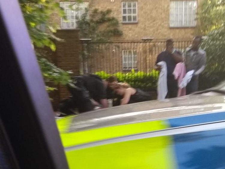 Someone being treated at the scene of the Peckham incident
